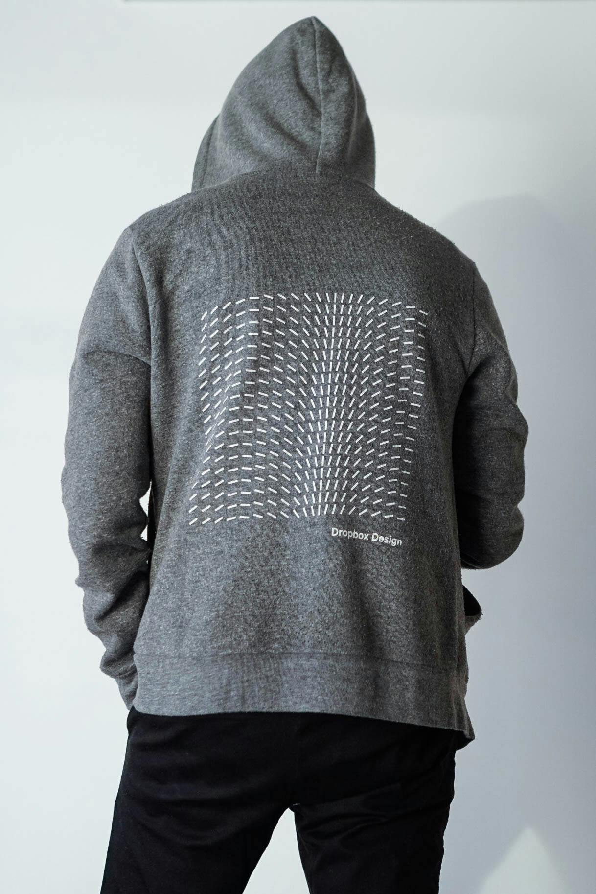 A Dropbox Design sweatshirt with some abstract, geometric art on the back
